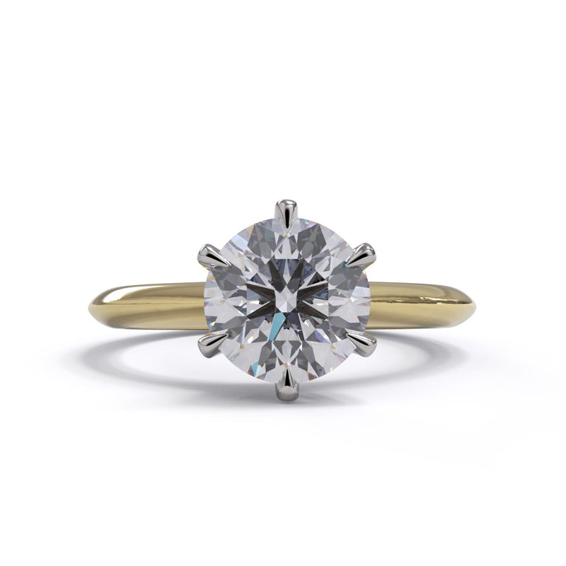 A yellow gold band solitaire ring with a round diamond set in a six-claw crown setting.