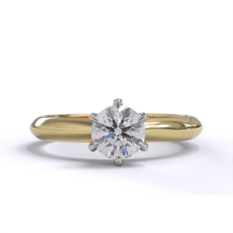 A yellow gold band solitaire ring with a round diamond.