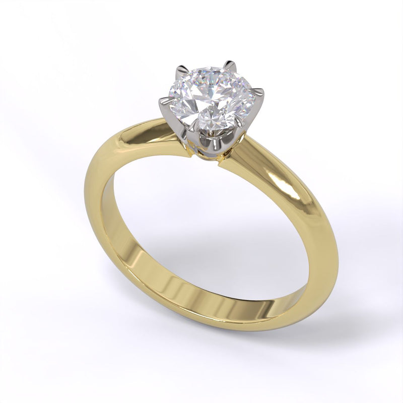 A yellow gold band solitaire ring with a round diamond.