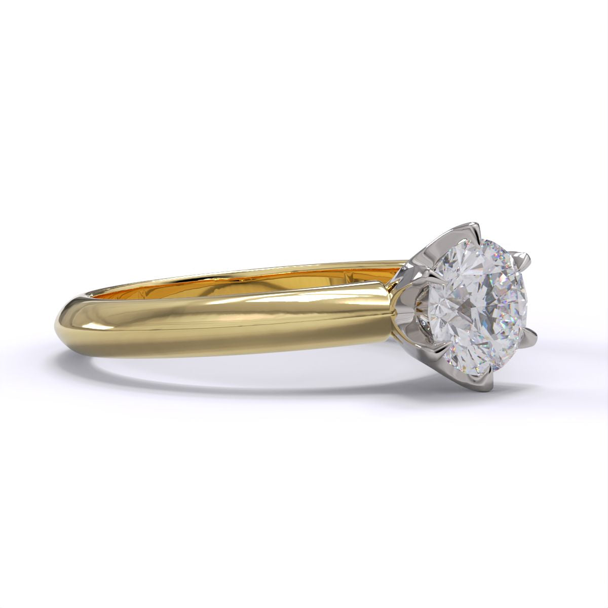 A yellow gold band solitaire ring with a round diamond.