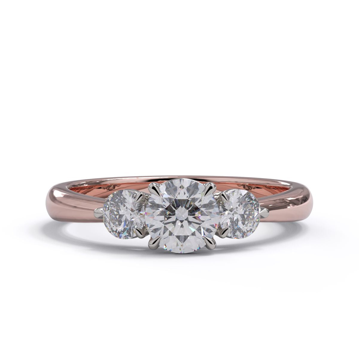 A three-stone diamond engagement ring with a rose gold band and platinum setting.