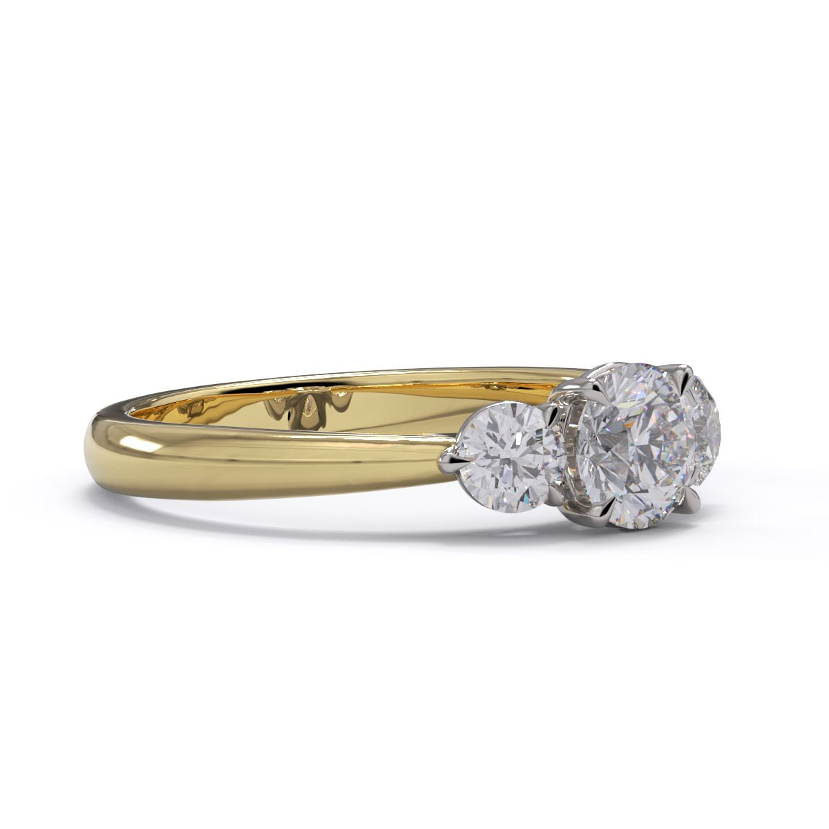 A three-stone diamond engagement ring with a yellow gold band and platinum setting.