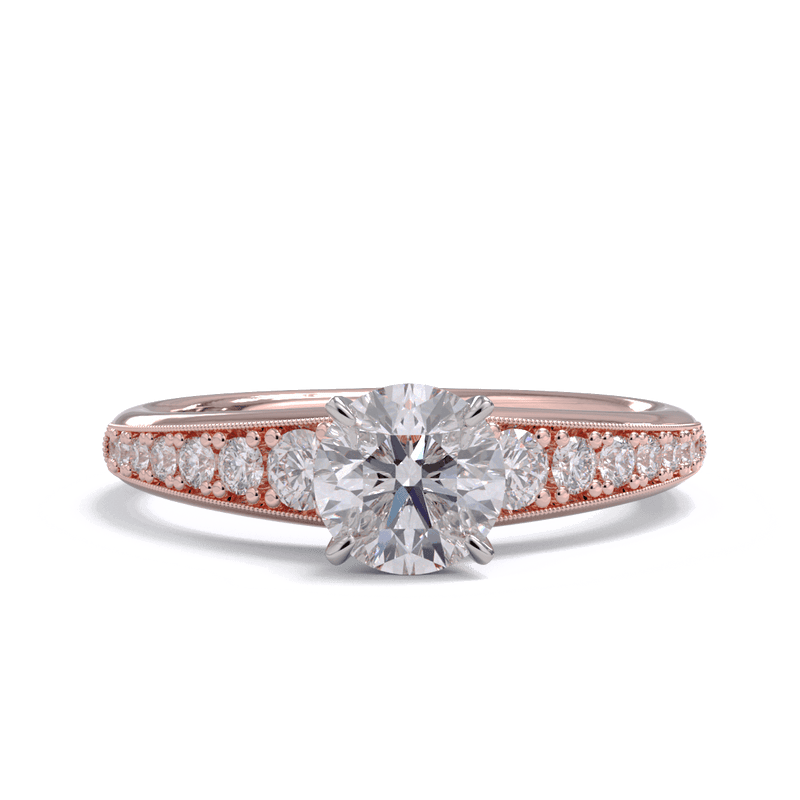 A rose gold round brilliant diamond solitaire ring with smaller diamonds along the band.