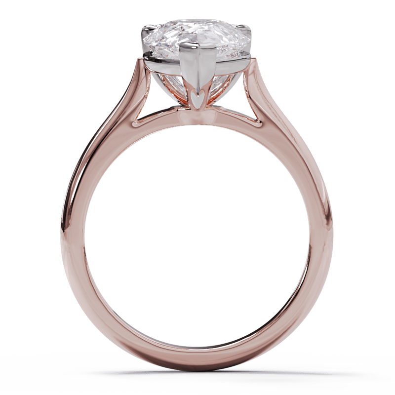 A pear-cut diamond solitaire ring with a double-claw setting and a rose gold band.