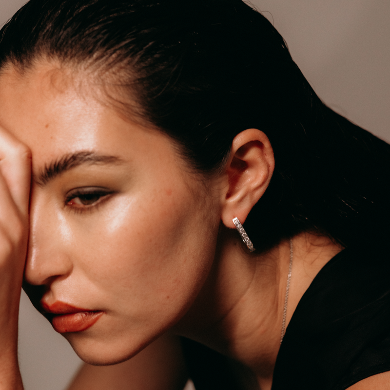 girl wearing diamond hoop earrings