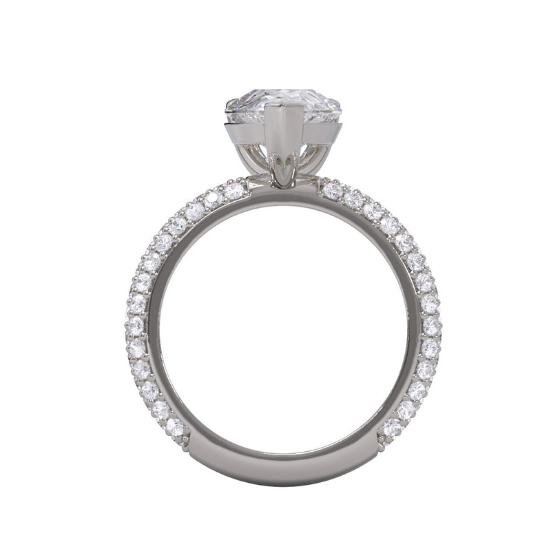An elegant engagement ring featuring a pear cut diamond center stone with a pavé band.