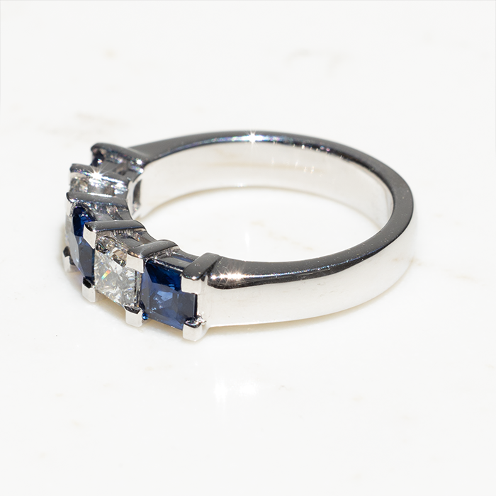 side veiw of 18k white gold ring with two diamonds and three sapphires