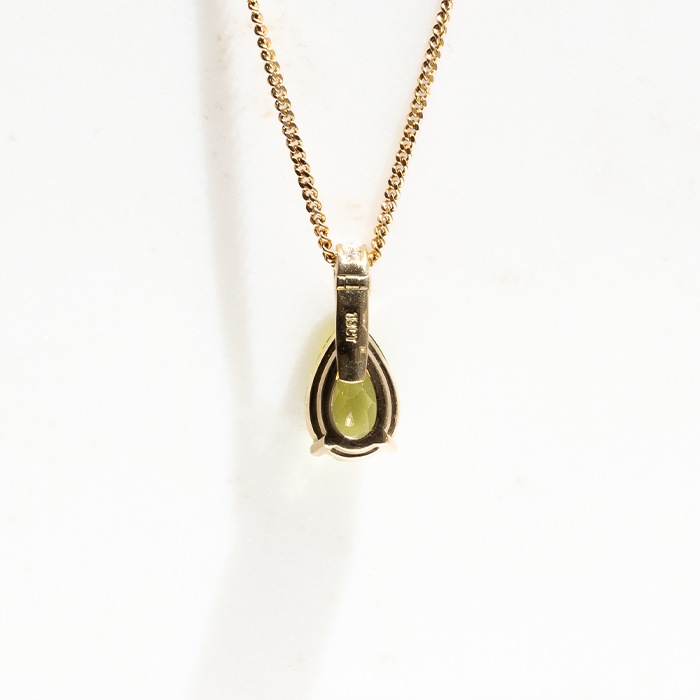 the back of the pendent showing the 18k yellow gold setting.