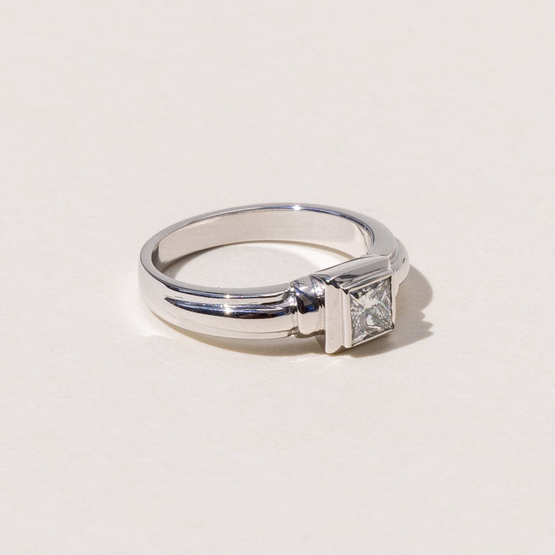 18ct white gold princess cut diamond solitaire ring on a white background.