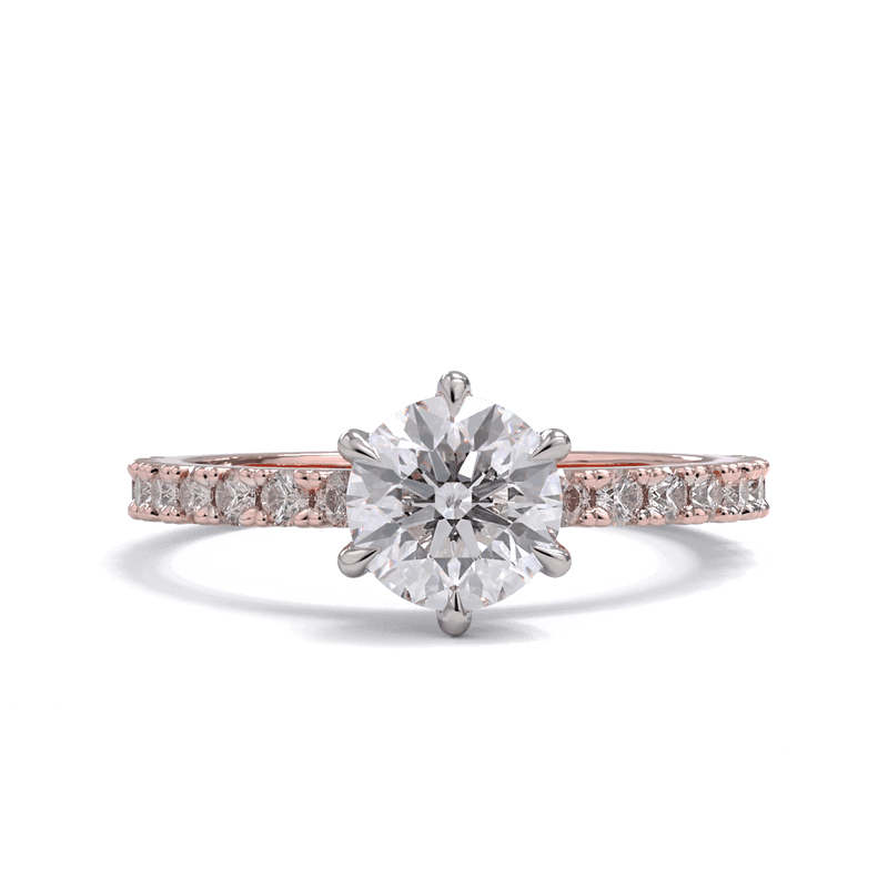 A round brilliant diamond solitaire ring with diamond pave on the band, set in a platinum on a rose gold band.