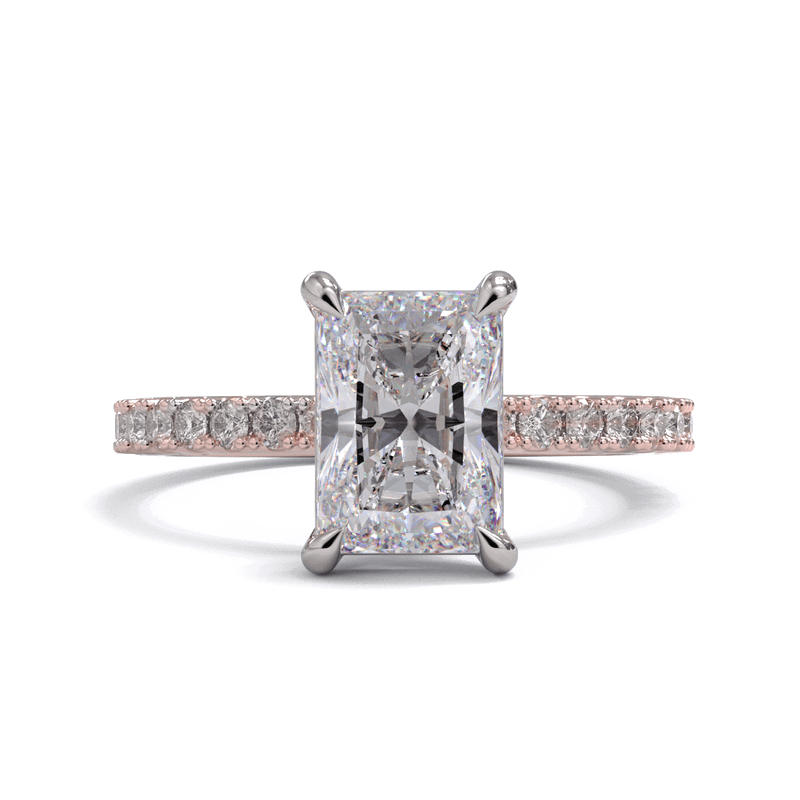A radiant cut diamond solitaire ring with a diamond pave band, set in a claw setting in platinum on a rose gold band.