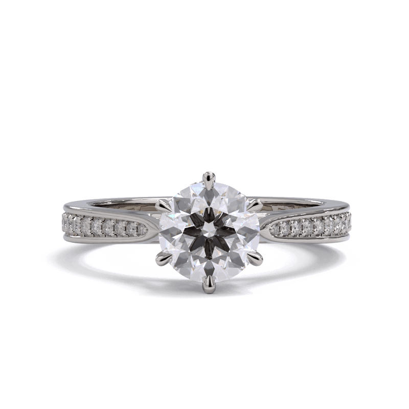 A round brilliant diamond solitaire ring with pave diamonds down the band, set in a platinum or white gold.