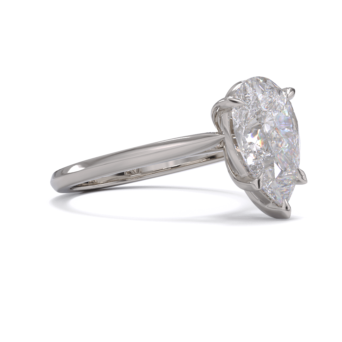 A solitaire ring with a pear-cut diamond center stone held by five-claw platinum or white gold setting