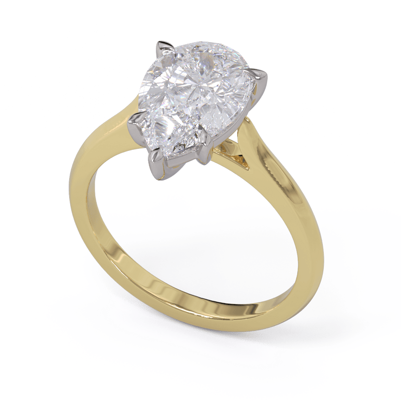 A solitaire ring with a pear-cut diamond center stone held by five-claw platinum setting on a yellow gold band.