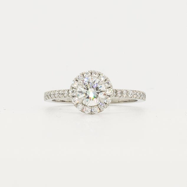 Round diamond ring with halo pave diamonds. Pave diamonds down the band