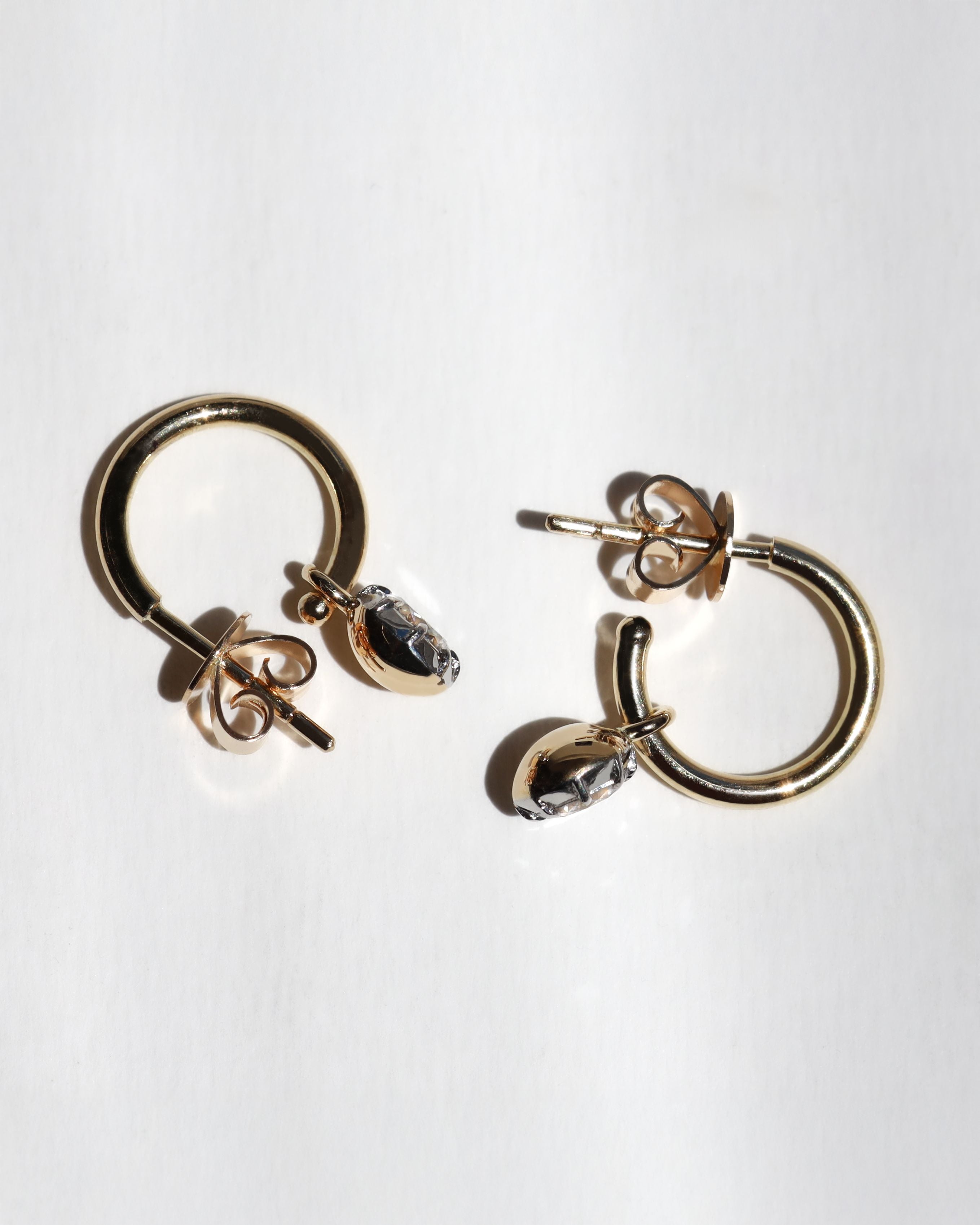 The best gold diamond huggie earrings, handmade in Auckand New Zealand by award winning jewellers. 