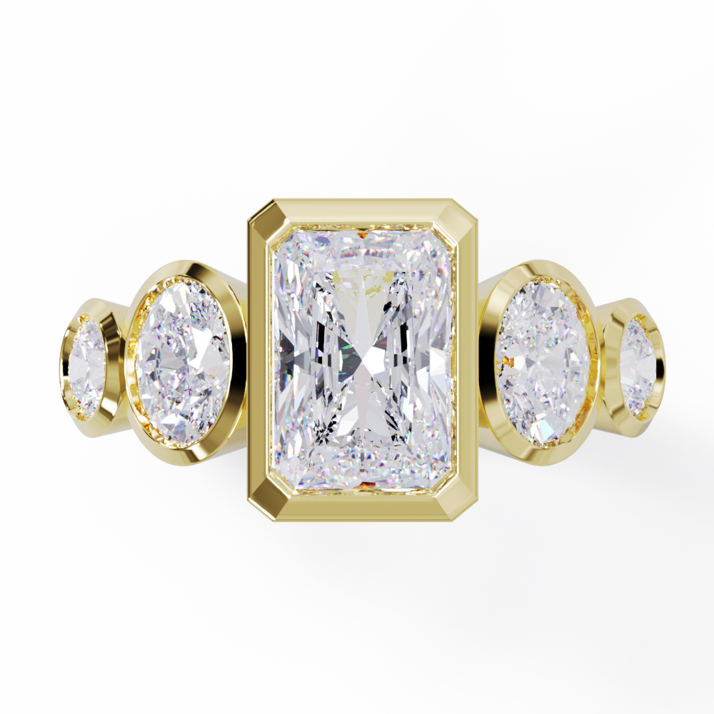 Yellow Gold ring with a central emerald-cut diamond flanked by two oval diamonds. Bezel set in a low profile. Top view