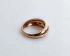 Rose gold ring on a white background