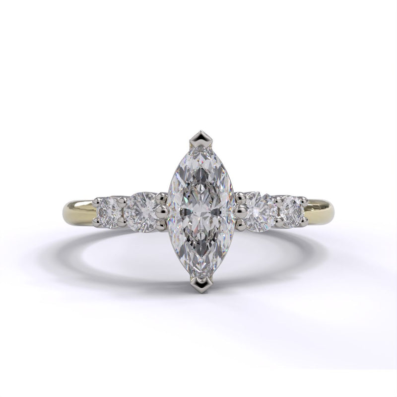 A marquise-cut diamond engagement ring with two round brilliant-cut diamonds on either side, set in platinum on a yellow gold band.