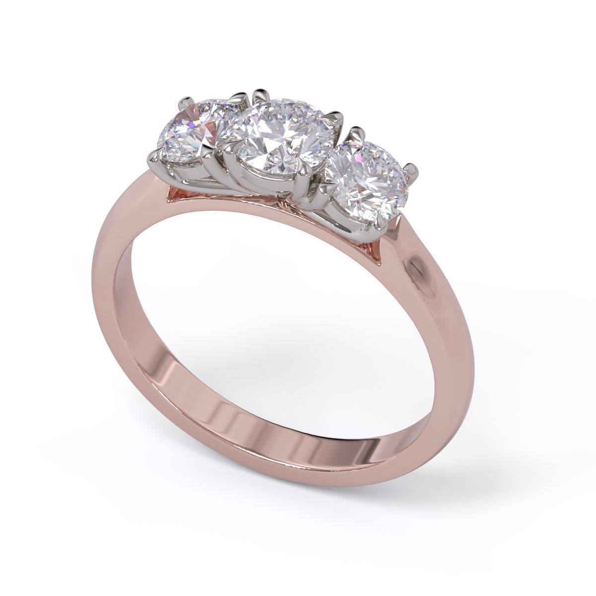 A three-stone diamond ring with a rose gold band and platinum setting for the diamonds.