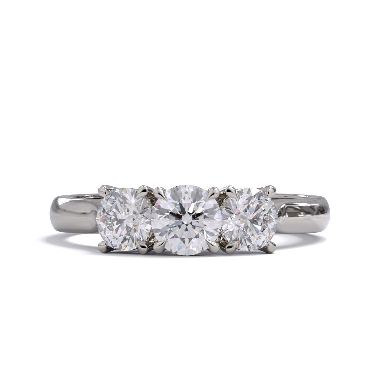 A three-stone diamond ring with a white gold or platinum band and platinum setting for the diamonds.
