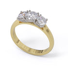 A three-stone diamond ring with a yellow gold band and platinum setting for the diamonds.