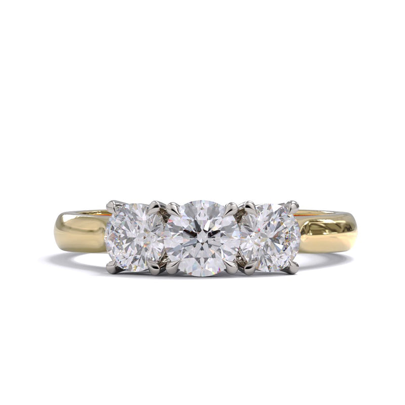 A three-stone diamond ring with a yellow gold band and platinum setting for the diamonds.