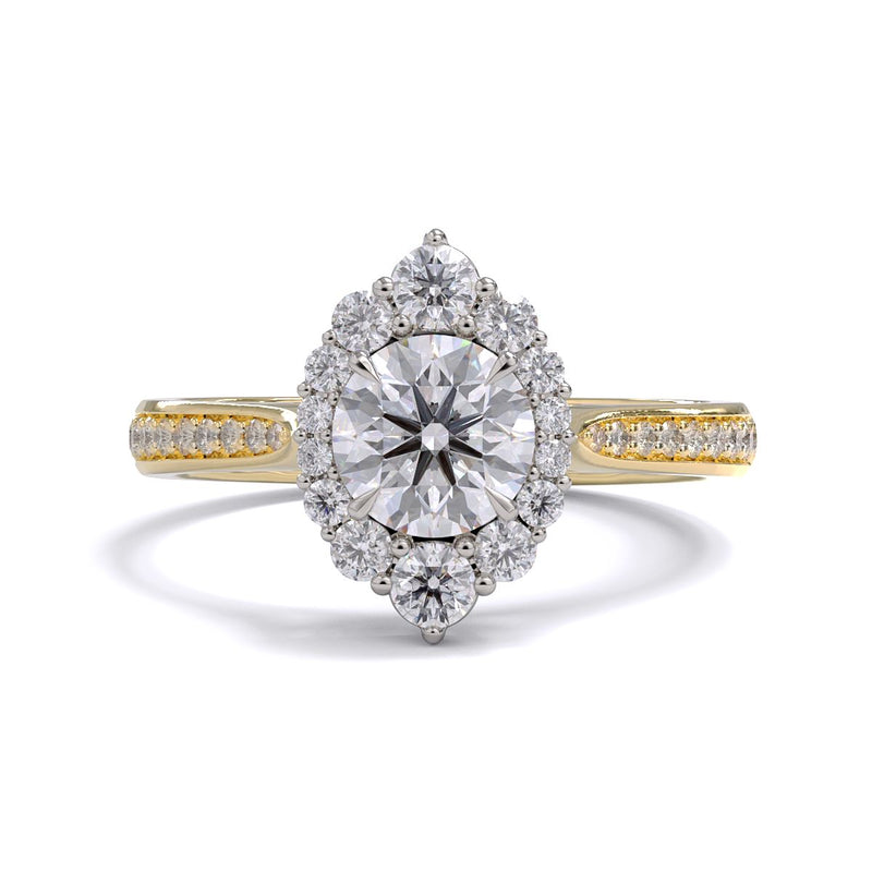A gold diamond ring with a large round central diamond surrounded by a halo of smaller round diamonds. Set in platinum on a yellow gold band with pave down on the band, displayed against a white background.
