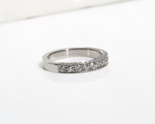 Platinum wedding band with 3 rows of pavé diamonds 