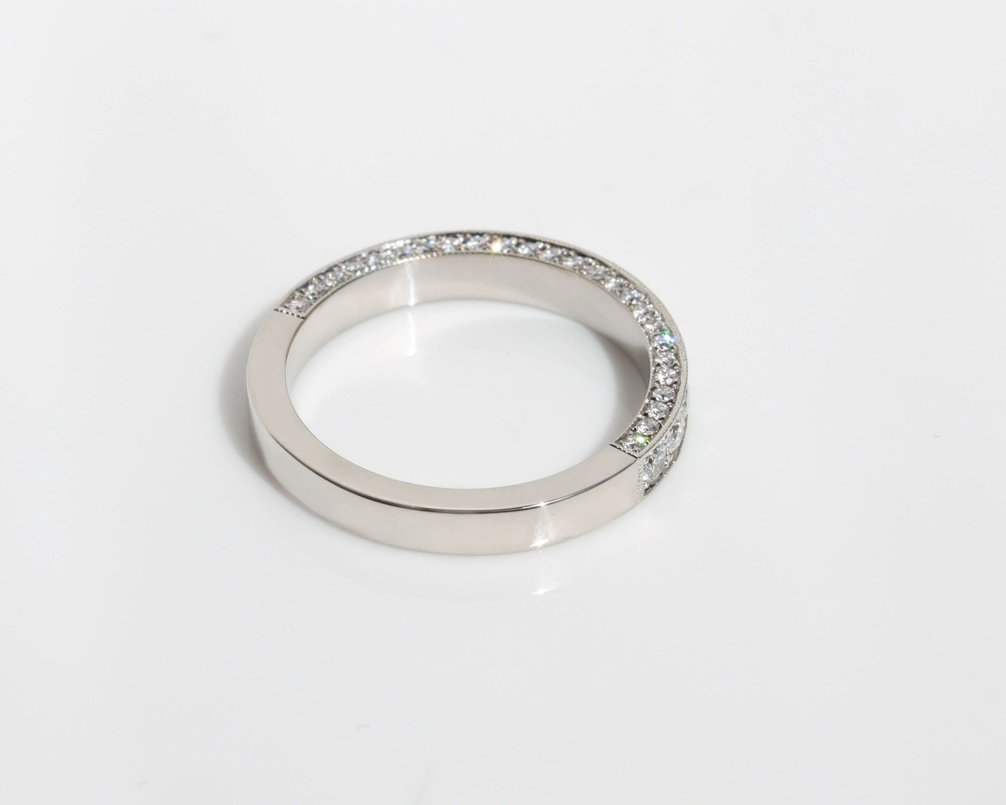 Platinum wedding band with 3 rows of pavé diamonds 