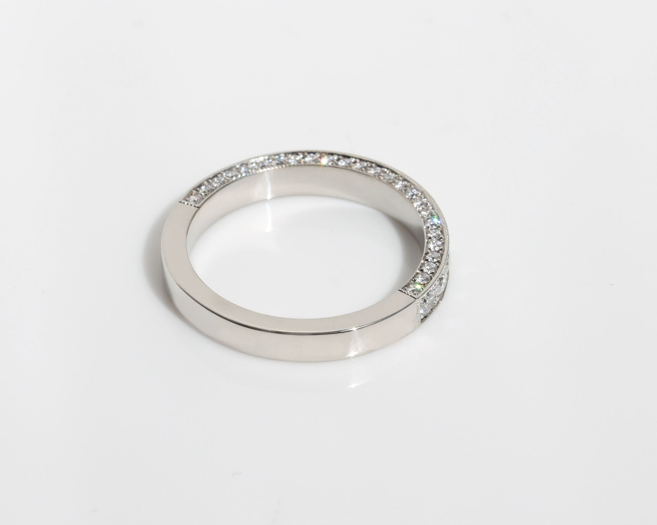 Platinum wedding band with 3 rows of pavé diamonds 