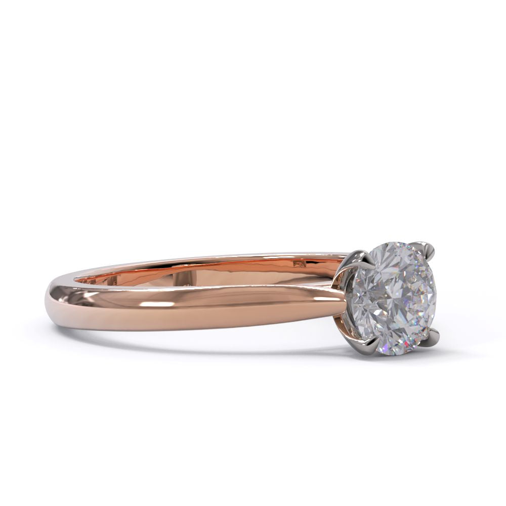 Rose gold ring with a diamond on a white background