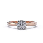 Rose gold ring with a diamond on a white background