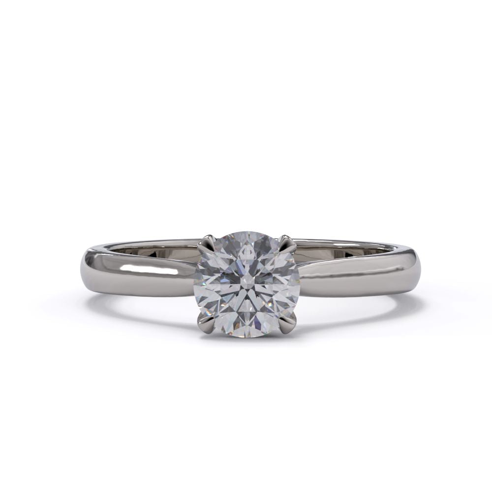 platinum solitaire ring with a diamond on a white background