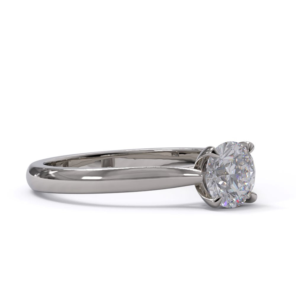 platinum diamond solitaire ring with four claws on a white backgroud