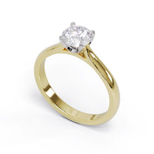 Yellow gold round diamond ring with a platinum diamond setting. 