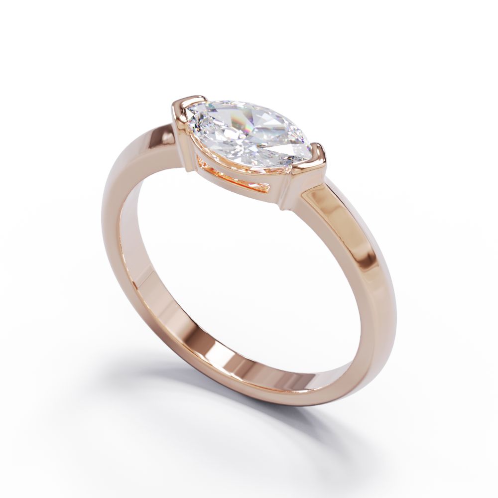 Rose gold diamond ring in a modern bezel set setting. 