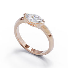 Rose gold diamond ring in a modern bezel set setting. 