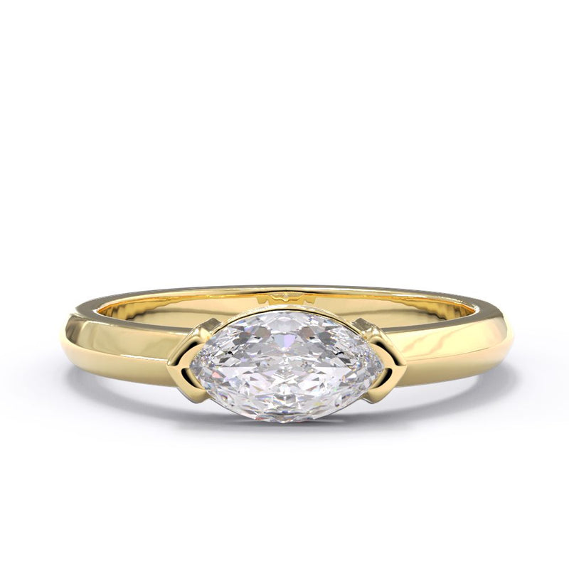 Gold ring with a large diamond on a white background