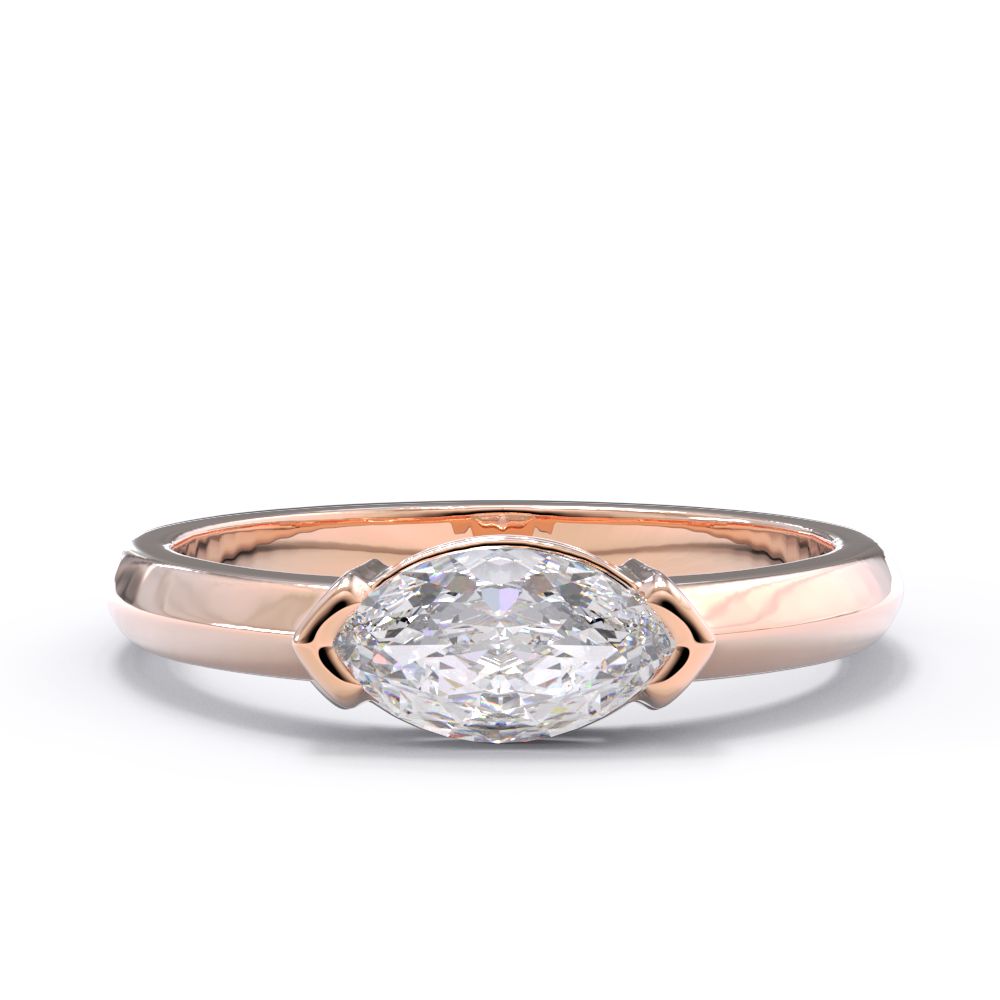 Rose gold east west marquise ring with a large diamond on a white background