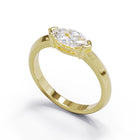 yellow solid gold ring with marquise diamond in a modern bezel set setting 