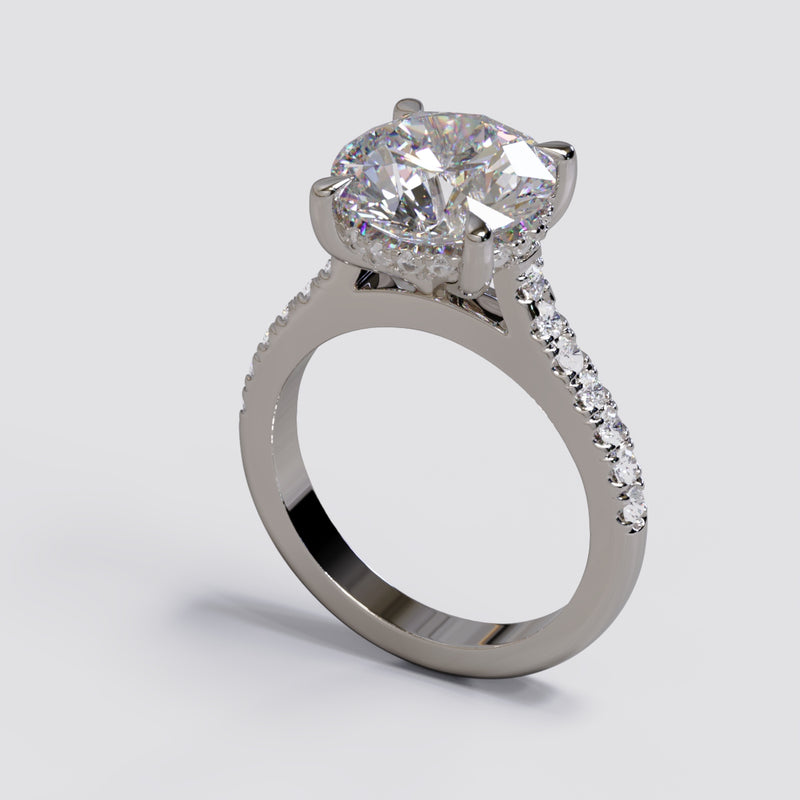 White Gold Ring. Round Brilliant Diamond Centre Stone with Hidden Halo and Pave diamonds on the band 