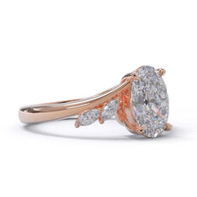 Rose gold ring with a large diamond and smaller marquise shaped diamonds on a white background. Made in Auckland New Zealand by our award winning team 