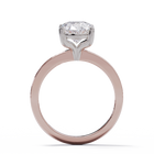Rose gold ring with a diamond on a white background