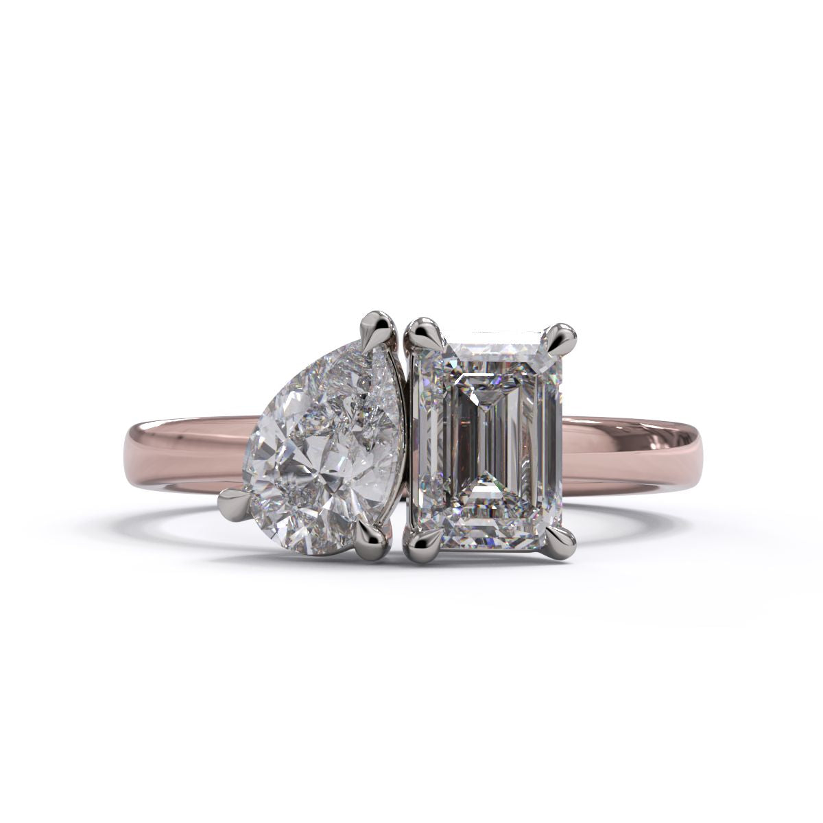 A solitaire diamond Toi et Moi style ring with a rose gold band set in a platinum setting.