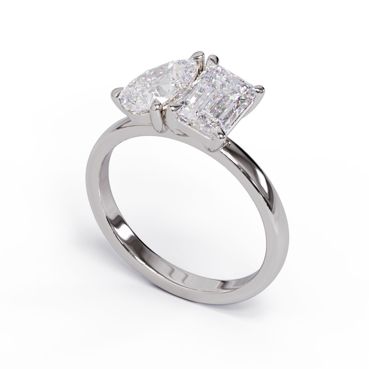 A solitaire diamond Toi et Moi style ring with a platinum or white gold band set in a platinum setting.