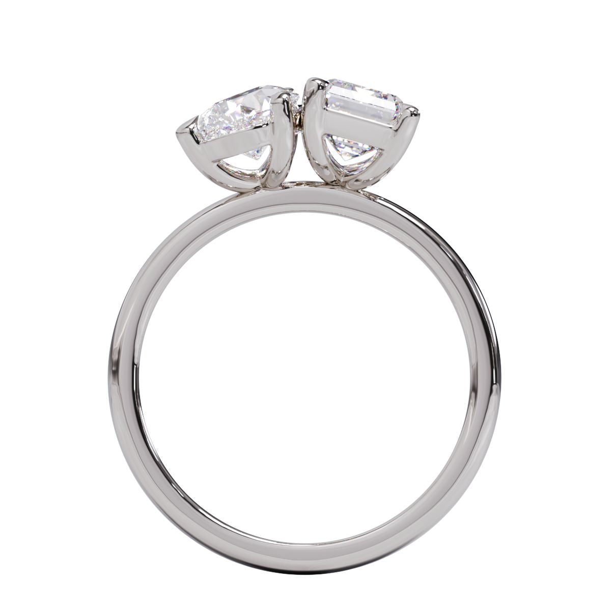 A solitaire diamond Toi et Moi style ring with a platinum or white gold band set in a platinum setting.
