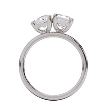 A solitaire diamond Toi et Moi style ring with a platinum or white gold band set in a platinum setting.