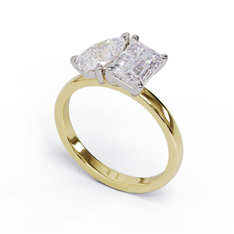 A solitaire diamond Toi et Moi style ring with a yellow gold band set in a platinum setting.
