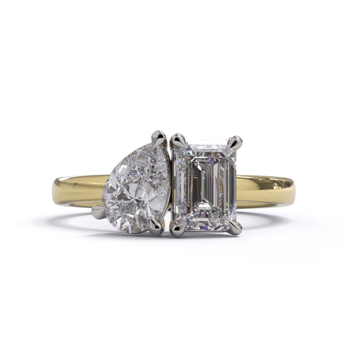 A solitaire diamond Toi et Moi style ring with a yellow gold band set in a platinum setting.